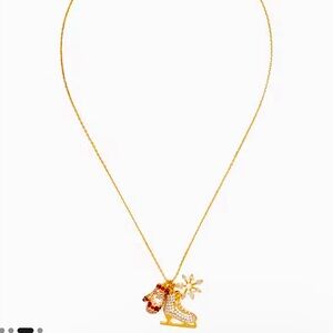 NWT Kate Spade gold necklace w/ ice skate, mitten & snowflake charms